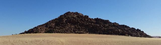 Namibia: Granite mountain behind 'Desert Camp' on the D826